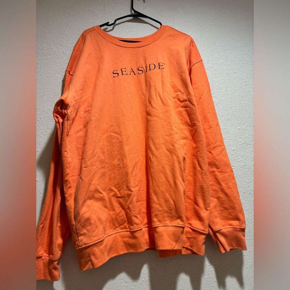 Vibrant Orange Crewneck Sweater with SEASIDE Print